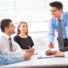 Group of human resources professionals having a discussion and smiling