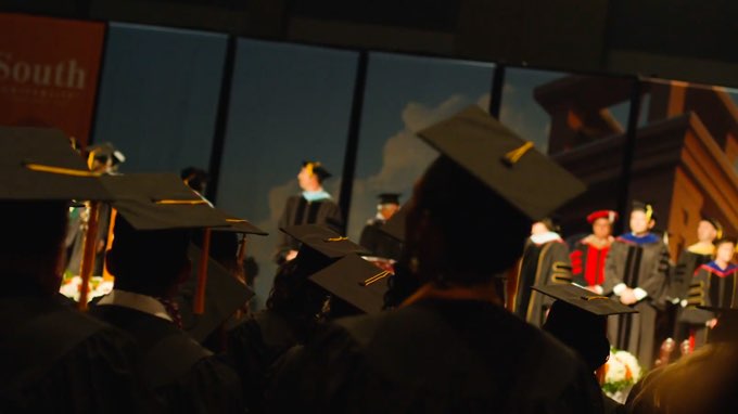 South University students graduating with caps and gowns