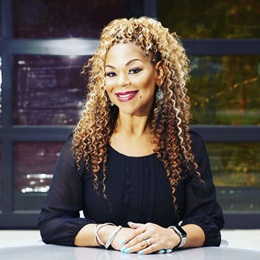 B. Christian Randolph headshot in a black blouse