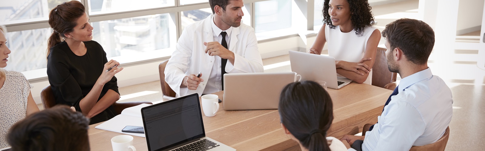 group of healthcare workers collaborating in a conference room