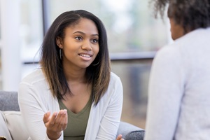 African American woman providing addiction counseling