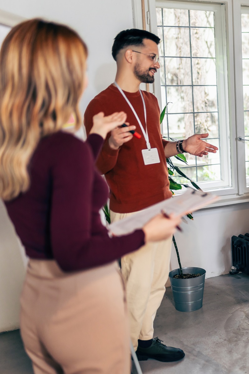 group of professionals discussing a project in a meeting room