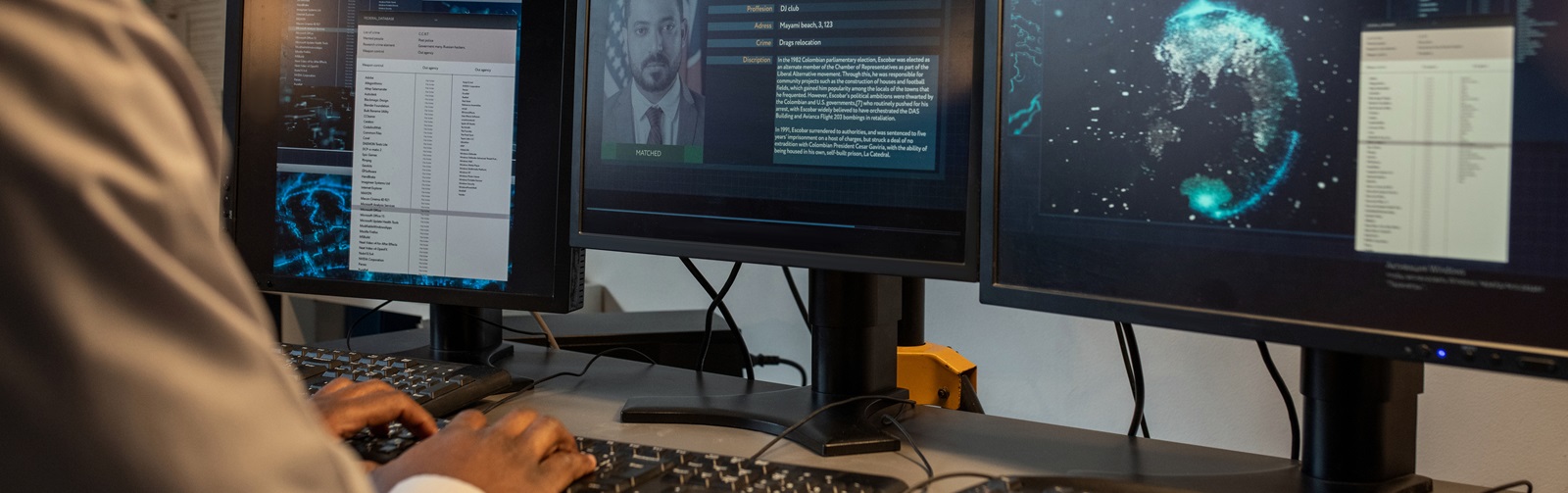 Young man typing on a keyboard reviewing code