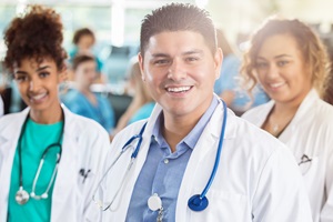 2 women and one male hospital staff standing together