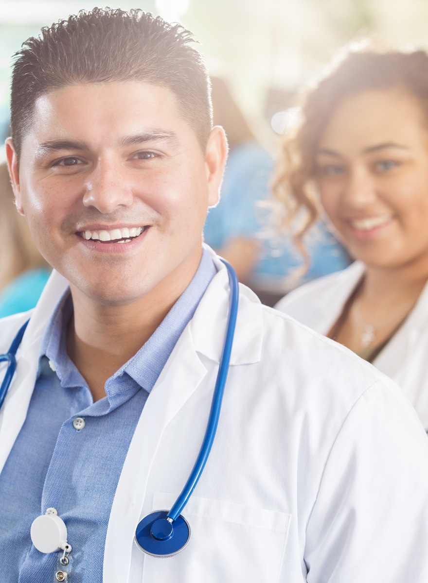 2 women and one male hospital staff standing together