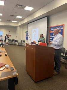 Jason Prevelige speaking to a group of students in a classroom at South University