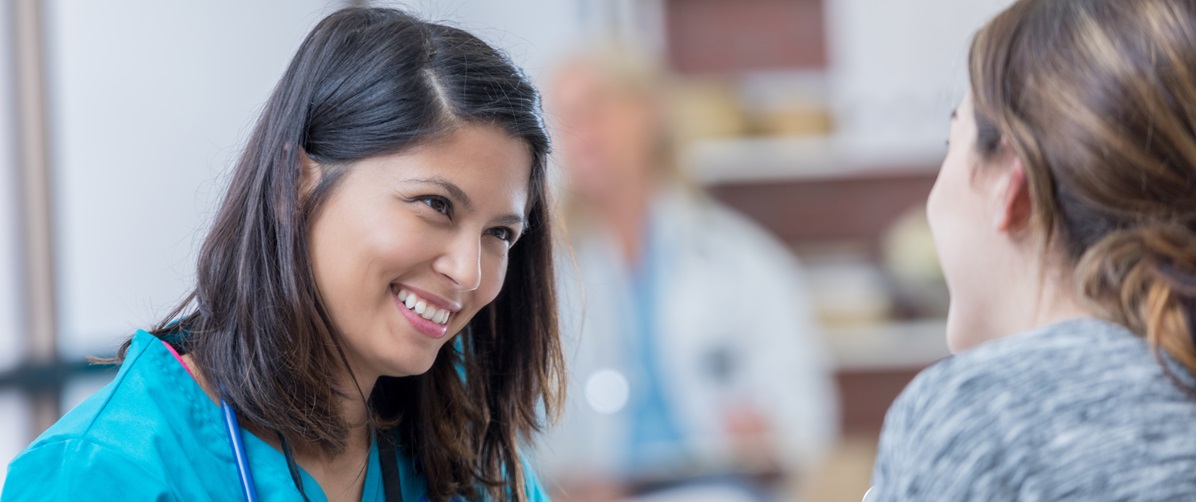 Advanced Practice Nurse consulting a patient