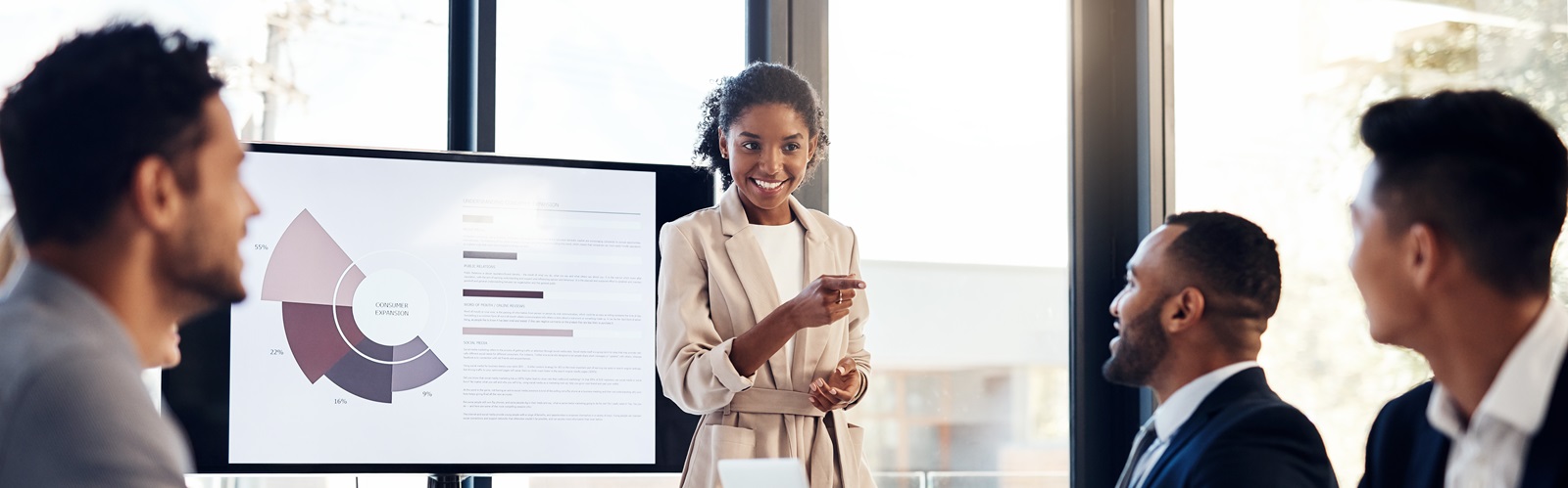 HR Meeting with young woman showing a presentation to 3 other people