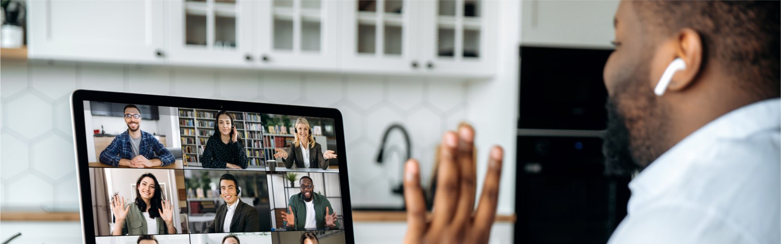 Man working from home in virtual meeting