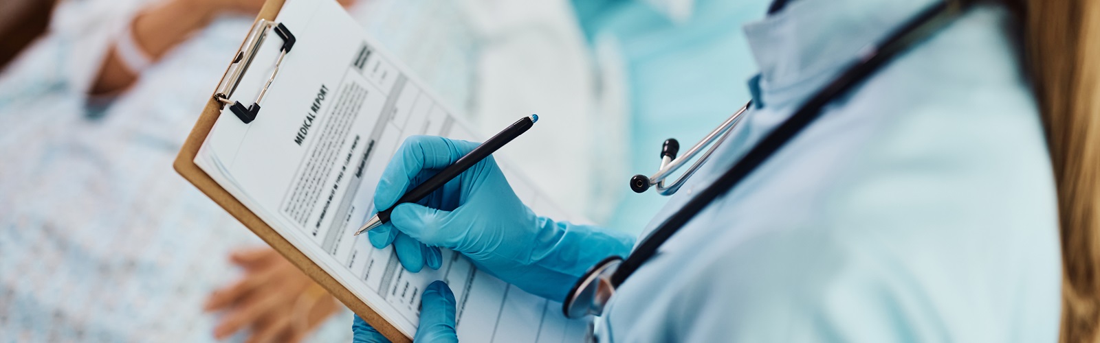 female nurse taking patient notes