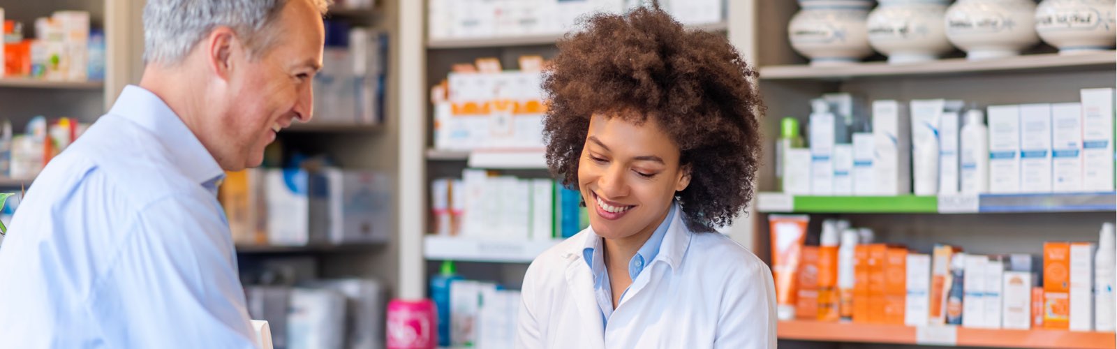 Female pharmacist consulting with patient