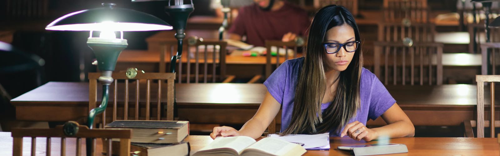 Female student in library studying