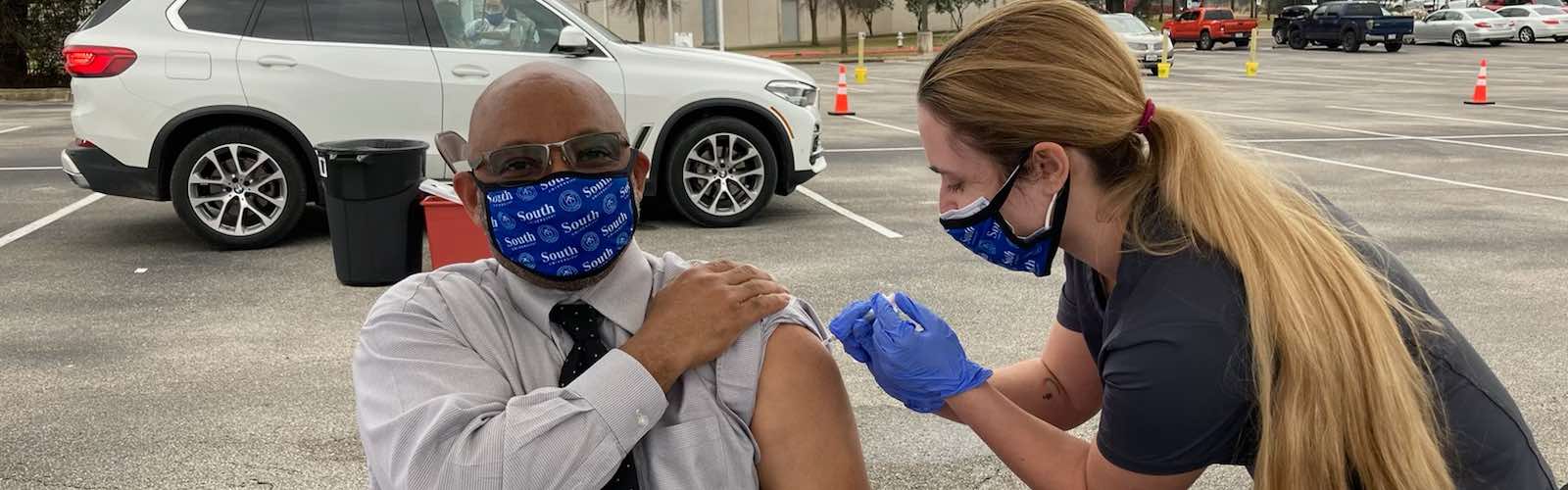 South University student administering the COVID-19 vaccine