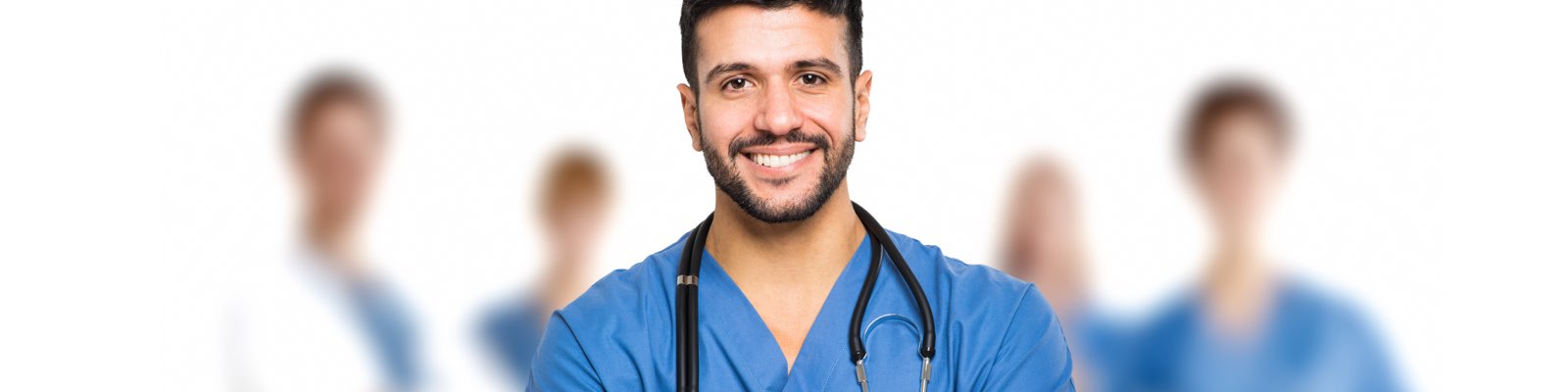 Male nurse smiling in front of team of doctors
